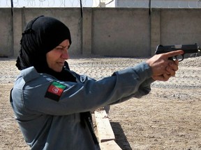Afghan Police Officer Second Lieutenant Islam Bibi training with the Ministry of Defence Police, in Helmand.