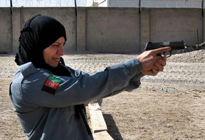 Afghan Police Officer Second Lieutenant Islam Bibi training with the Ministry of Defence Police, in Helmand.