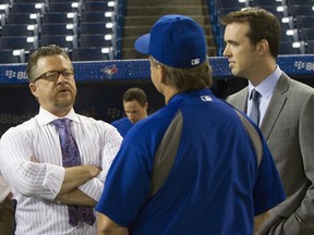 In a rare appearance during batting practice, Sportsnet commentators Gregg Zaun, left, and Dirk Hayhurst, right, chat with Blue Jays manager John Gibbons in July 2013.