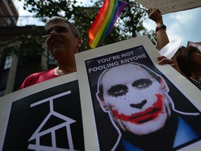 Protesters hold a demonstration against Russian anti-gay legislation and against Russian President Vladimir Putin stands on gay rights, in front of the Russian Consulate in New York.
