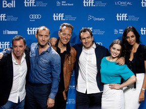 Cast and crew of the film Dom Hemingway, from left, director Richard Shepard, actors Jude Law, Richard E. Grant, Demian Bichir, Emilia Clarke and Madalina Ghenea.