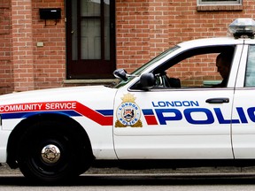 A London, Ont. police officer sits in his car in a 2009 file photo.