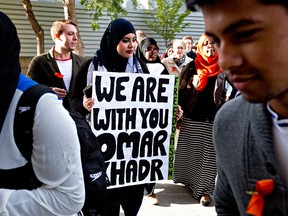 Supporters rally outside the Edmonton courthouse during former Guantanamo Bay inmate Omar Khadr's court appearance in Edmonton, Alberta on Monday September 23, 2013.