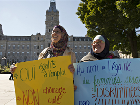 Two Muslim women demonstrate against the proposed Quebec charter of values outside the legislature in Quebec City in 2013.