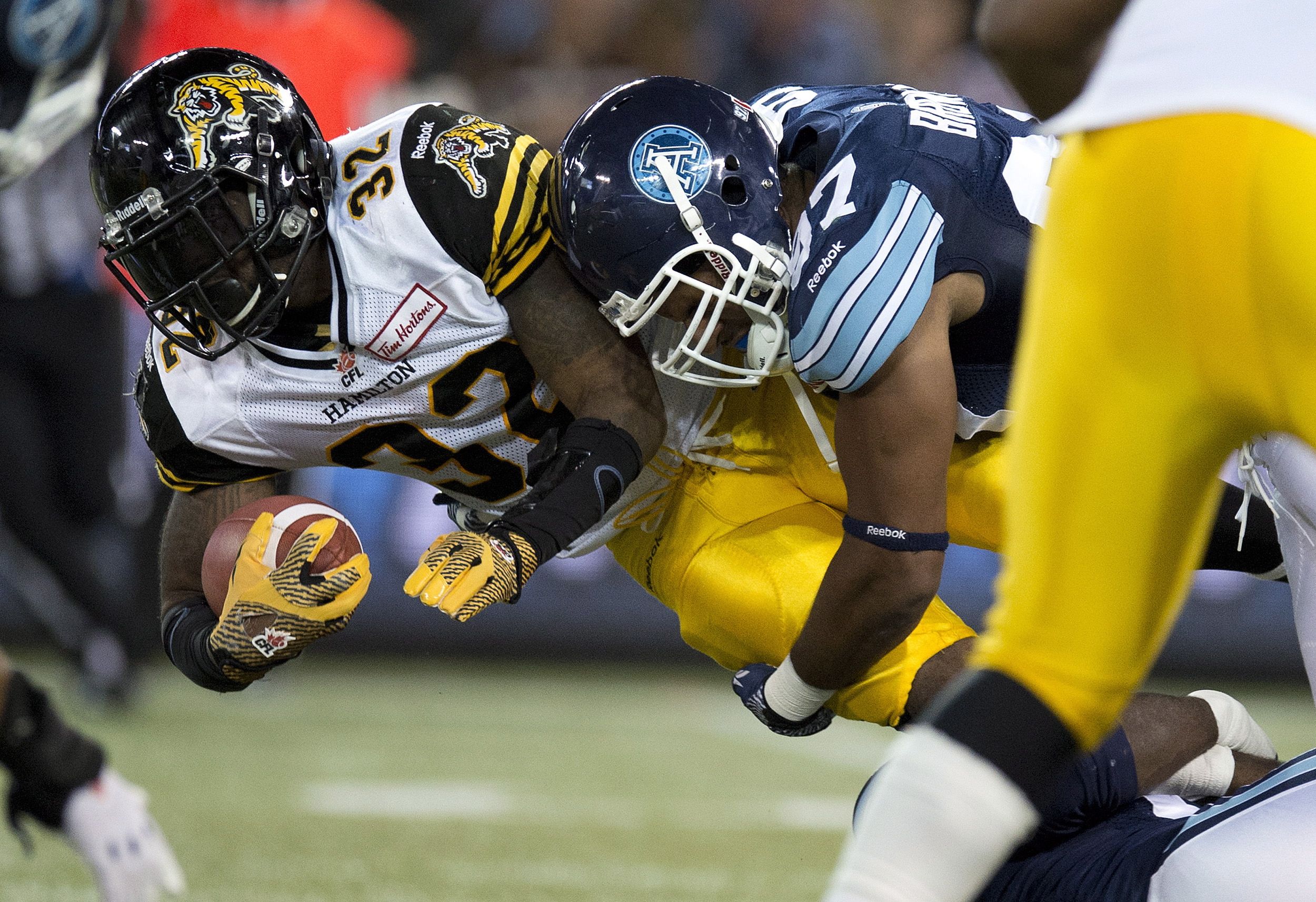 Kelly rushes for 3 TDs as defending champion Argonauts beat Tiger-Cats in  season opener