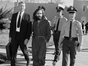 This Dec. 3, 1969 file photo shows Charles Manson en route to court in Independence, California.