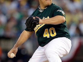 OAKLAND, CA - OCTOBER 04:  Bartolo Colon #40 of the Oakland Athletics throws a pitch in the first inning against the Detroit Tigers during Game One of the American League Division Series at O.co Coliseum on October 4, 2013 in Oakland, California.  (Photo by Ezra Shaw/Getty Images)