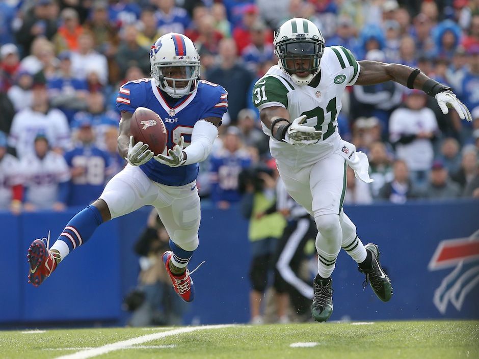 Fullback Frank Summers of the Buffalo Bills holds a football during