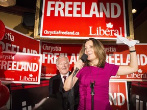 Liberal Candidate Chrystia Freeland, right, stands with Bob Rae as she celebrates after winning the Toronto Centre Federal byelection in Toronto on Monday Nov. 25, 2013.