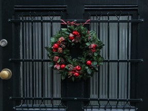 Traditional Christmas wreath on a glass door