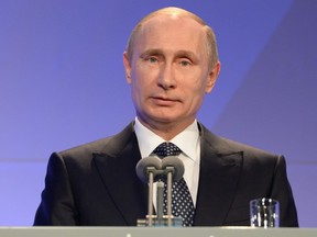 Russian President Vladimir Putin delivers his speech at the International Olympic Committee (IOC) Gala Dinner on February 6, 2014 in Sochi, on the eve of the Sochi 2014 Olympic Winter Games opening ceremony.  AFP PHOTO / POOL / ANDREJ ISAKOVICANDREJ ISAKOVIC/AFP/Getty Images