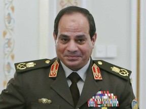 Egyptian Army chief Field Marshal Abdel Fattah al-Sisi arrives at a meeting with Russian President Vladimir Putin at the Novo-Ogaryovo state residence outside Moscow, Thursday, Feb. 13, 2014. Russian President Vladimir Putin on Thursday wished Egypt's military chief victory in the nation's presidential vote as Moscow sought to expand its military and other ties with a key U.S. ally in the Middle East. (AP Photo/ Maxim Shemetov, Pool)