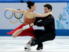 Canada's Scott Moir and Canada's Tessa Virtue perform in the Figure Skating Team Ice Dance Free Dance at the Iceberg Skating Palace during the Sochi Winter Olympics on February 9, 2014.    AFP PHOTO / YURI KADOBNOVYURI KADOBNOV/AFP/Getty Images