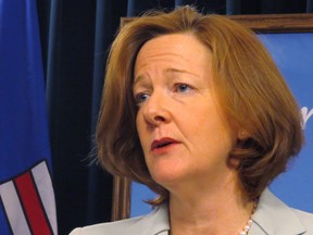Alberta Premier Alison Redford speaks to reporters in Edmonton on Tuesday March 4, 2014. Redford revealed Tuesday that she spent taxpayers' money to fly her daughter's friends around on government aircraft, but says she will now pay back the $3,100 tab. THE CANADIAN PRESS/Dean Bennett