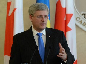 Prime Minister Stephen Harper takes part in a joint press conference with Ukrainian Prime Minister Areseniy Yatsenyuk at the Cabinet of Ministers in Kyiv, Ukraine, on Saturday, March 22, 2014.