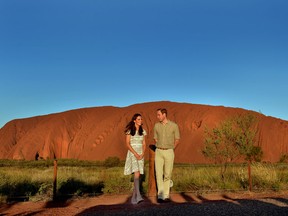 AYERS ROCK, AUSTRALIA - APRIL 22:  Catherine, Duchess of Cambridge and Prince William, Duke of Cambridge pose in front of Uluru, also known as Ayers Rock, on April 22, 2014 in Ayers Rock, Australia. The Duke and Duchess of Cambridge are on a three-week tour of Australia and New Zealand, the first official trip overseas with their son, Prince George of Cambridge. (Photo by Anthony Devlin -  Pool / Getty Images)