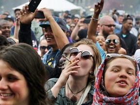 Partygoers dance to live music and smoke pot at the annual 4/20 marijuana festival in Denver, April 19, 2014.