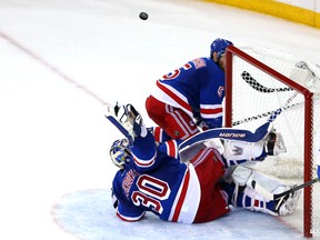 NEW YORK, NY - MAY 29:Henrik Lundqvist #30 of the New York Rangers makes a save against the Montreal Canadiens  during Game Six of the Eastern Conference Final in the 2014 NHL Stanley Cup Playoffs at Madison Square Garden on May 29, 2014 in New York City.  (Photo by Elsa/Getty Images)