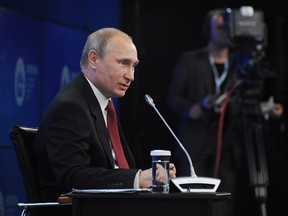 THE CANADIAN PRESS/AP, Mikhail Klimentyev, Presidential Press Service