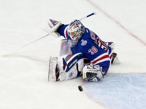 NEW YORK, NY - JUNE 11:  Henrik Lundqvist #30 of the New York Rangers makes a save during the second period of Game Four of the 2014 NHL Stanley Cup Final at Madison Square Garden on June 11, 2014 in New York, New York.  (Photo by Paul Bereswill/Getty Images)