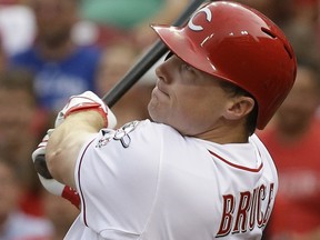 Cincinnati Reds' Jay Bruce watches his two-run home run off Toronto Blue Jays relief pitcher Todd Redmond in the second inning of a baseball game, Friday, June 20, 2014, in Cincinnati. (AP Photo/Al Behrman)