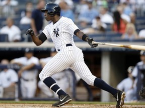 New York Yankees' Alfonso Soriano hits a first-inning RBI single in a baseball game against the Toronto Blue Jays at Yankee Stadium in New York, Wednesday, June 18, 2014. (AP Photo/Kathy Willens)