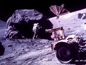 For some, it is the stop at the Moon, not the ultimate destination of Mars, that catches their scientific fancy in the new human exploration initiative that President Bush will propose on Wednesday, Jan. 14, 2004. Harrison H. Schmitt works beside a huge boulder during the third Apollo 17 extravehicular activity on the moon, Dec. 13, 1972.