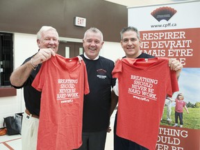 Robert Alexander Carew (far right), along with Robert Davidson and MPP Kevin Flynn