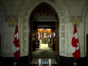 The doors to the House of Commons open awaiting the arrival of the daily Speakers Parade Wednesday June 11, 2014 in Ottawa. THE CANADIAN PRESS/Adrian Wyld