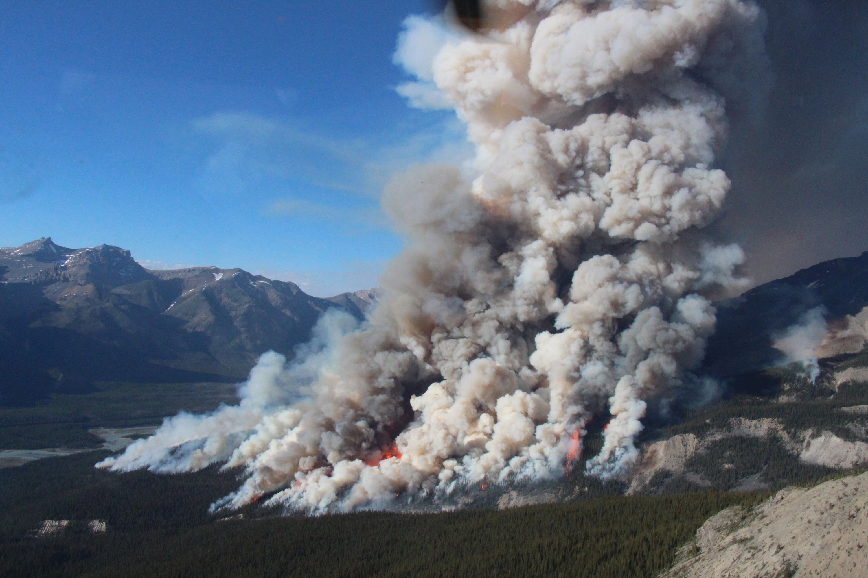 Ravenous forest fire swallowing tens of thousands of litres of water