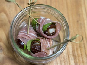 Prosciutto wrapped dates with basil and parm.