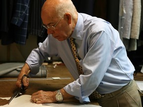 Tailor Nino Corvato cutting suit pieces in the documentary Men of the Cloth