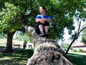 Kara Wheeler sits on a tree in Regina Beach.