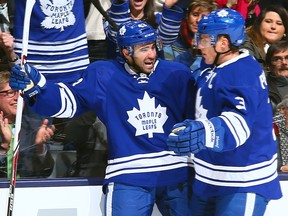 TORONTO, ON - JANUARY 28:  Nazem Kadri #43and Dion Phaneuf #3 of the Toronto Maple Leafs celebrate Kadri's goal against the Tampa Bay Lightning during NHL action at the Air Canada Centre January 28, 2014 in Toronto, Ontario, Canada.  (Photo by Abelimages/Getty Images)