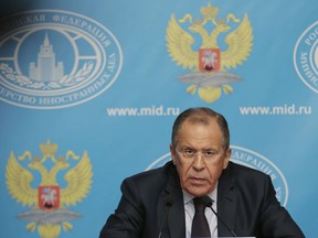 Russia's Foreign Minister Sergey Lavrov speaks in Moscow, Russia, Monday, Aug. 25, 2014. Russia has announced plans to send a second aid convoy to rebel-held eastern Ukraine, where months of fighting have left many residential buildings in ruins.