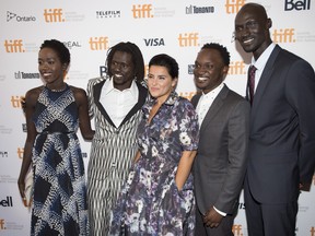 Kuoth Wiel, Emmanuel Jal, Nelly Furtado, Arnold Oceng, Ger Duany pose