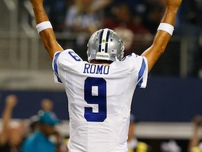 Tony Romo celebrates after throwing a touchdown pass to Dez Bryant.