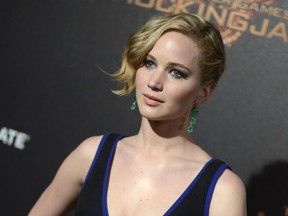 FILE - In this May 17, 2014 file photo, Jennifer Lawrence appears at the "Hunger Games: Mockingjay - Part 1" party at the 67th international film festival, Cannes, southern France. Lawrence, 24, is speaking out about those nude photos that were stolen via hacking and posted online in an exclusive interview with Vanity Fair for its November issue. The Nov. issue of Vanity Fair goes on sale Oct. 14. (Photo by Arthur Mola/Invision/AP, File)