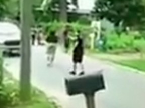 A screengrab from video of a Florida police officer hitting a woman in the back with a taser.