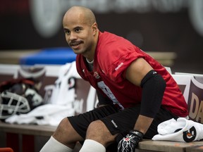 Calgary Stampeders running back Jon Cornish sits on the bench during a practice Friday November 28, 2014 in Vancouver. The Stampeders will play against the Hamilton Tiger-Cats Sunday in the 102nd CFL Grey Cup. THE CANADIAN PRESS/Paul Chiasson