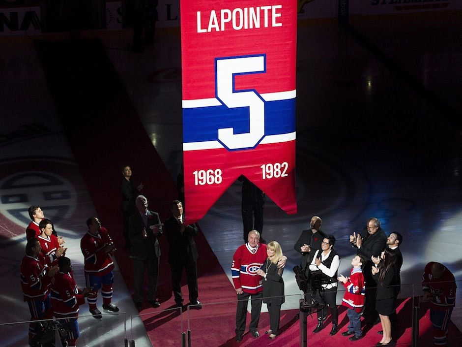 A photo of the banners commemorating the retired jerseys of Serge