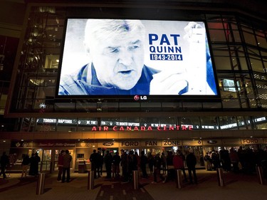 A tribute to Pat Quinn is displayed on a video screen at the Air Canada Centre in Toronto on Nov. 24, 2014.