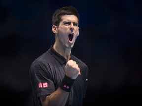 LONDON, ENGLAND - NOVEMBER 14:  Novak Djokovic of Serbia celebrates during the round robin singles match against Tomas Berdych of Czech Republic on day five of the Barclays ATP World Tour Finals at O2 Arena on November 14, 2014 in London, England.  (Photo by Justin Setterfield/Getty Images)