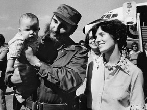 Margaret Trudeau smiles as then-Cuban President Fidel Castro holds her youngest son Michel after the Trudeaus arrived in Havana, Cuba, Jan.26, 1976.