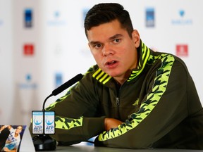 LONDON, ENGLAND - NOVEMBER 13:  Milos Raonic of Canada speaks at a press conference after pulling out of the tournament with an injury on day five of the Barclays ATP World Tour Finals at O2 Arena on November 13, 2014 in London, England.  (Photo by Julian Finney/Getty Images)