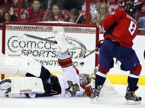 Washington Capitals left wing Alex Ovechkin (8), from Russia, scores the winning goal over Florida Panthers goalie Al Montoya (35) in the shootout portion of an NHL hockey game, Saturday, Oct. 18, 2014, in Washington. The Capitals won 2-1. (AP Photo/Alex Brandon)
