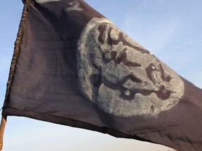 A Boko Haram flag flutters from an abandoned command post in Gamboru deserted after Chadian troops chased them from the border town on February 4, 2015.