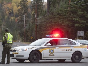 A Surete du Quebec police officer near a cruiser in this 2012 file photo.