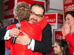 Ontario Premier Kathleen Wynne and former NDP MP  Glenn Thibeault embrace as they celebrate Thibeault's  byelection win in Sudbury, Ontario.  OPP charged a Liberal operative with bribery offences in relation to the campaign.