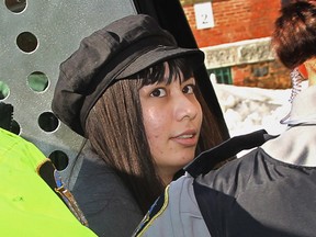 Lindsay Souvannarath, from Geneva, Ill., arrives at provincial court in Halifax on Tuesday, Feb. 17, 2015.